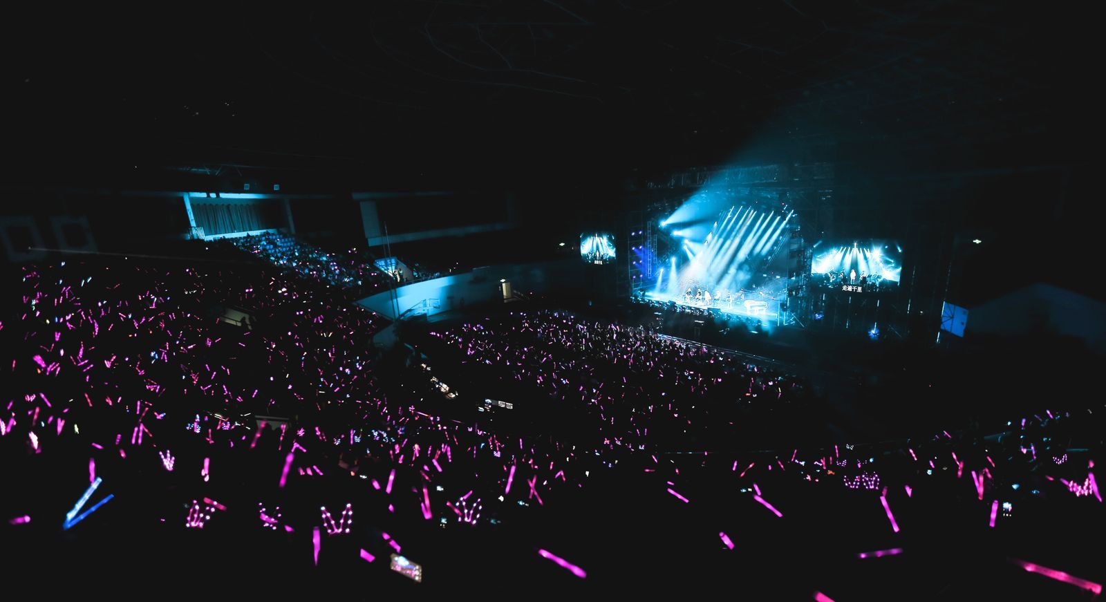 A concert crowd under stage lights