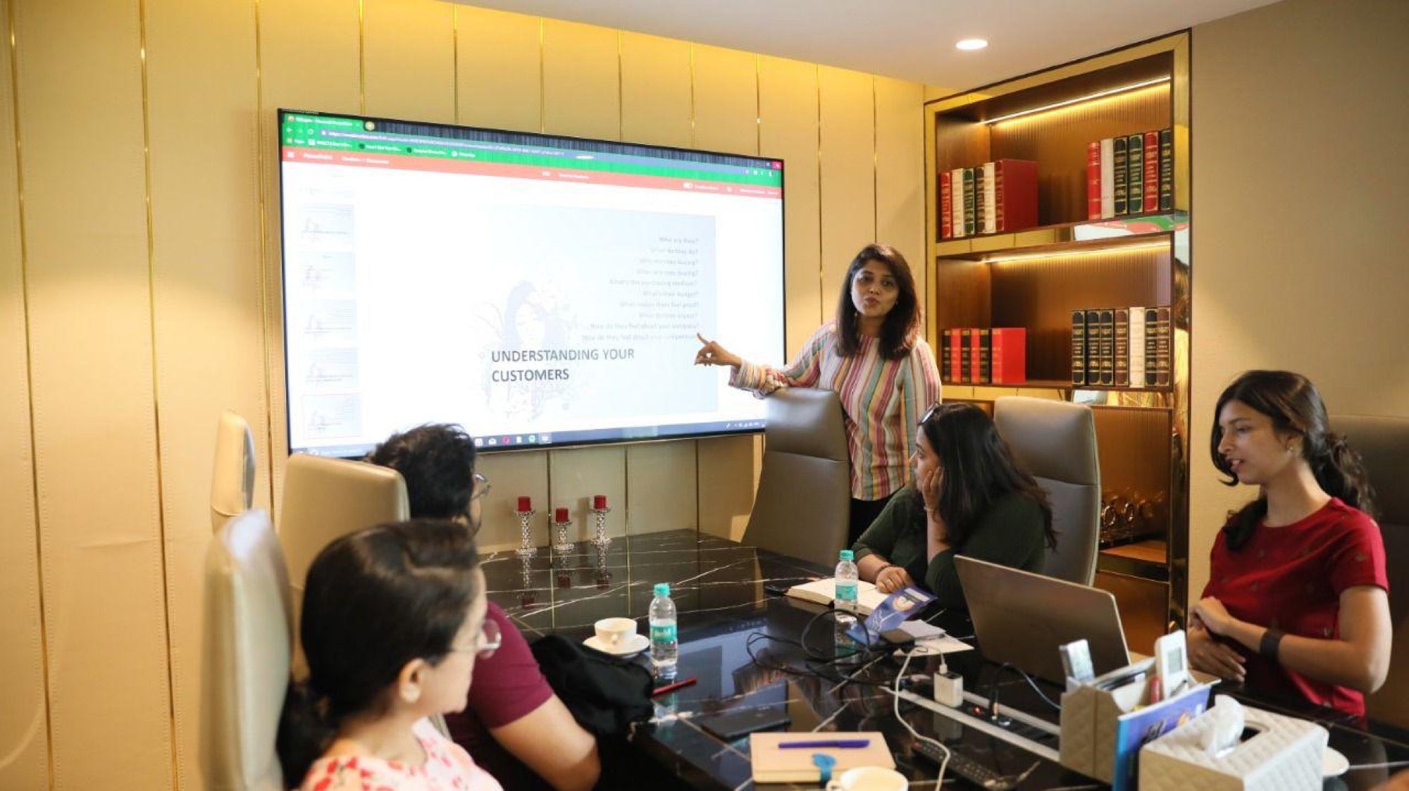 A session in progress around a boardroom screen