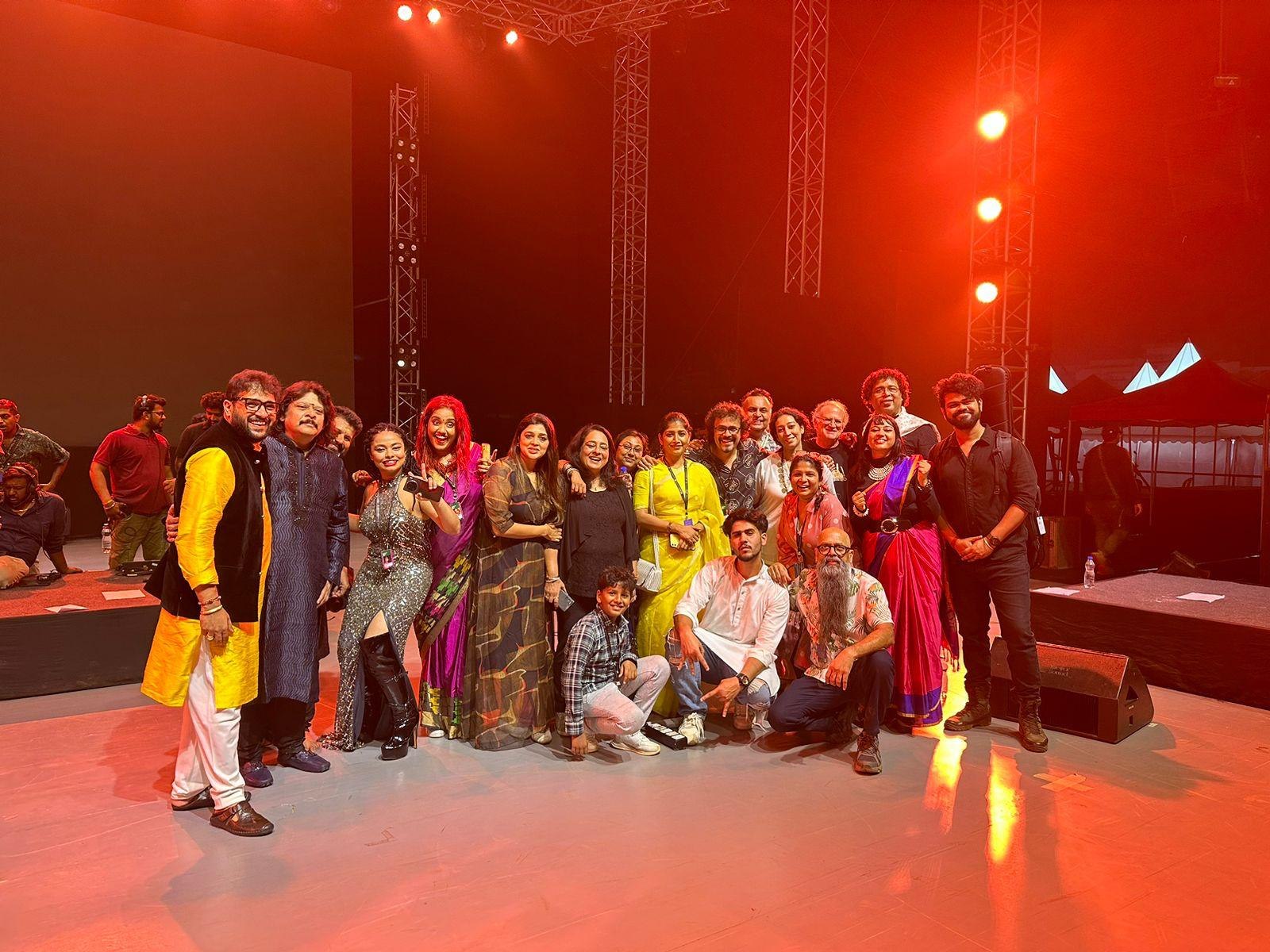 Performers and crew together on stage after a show