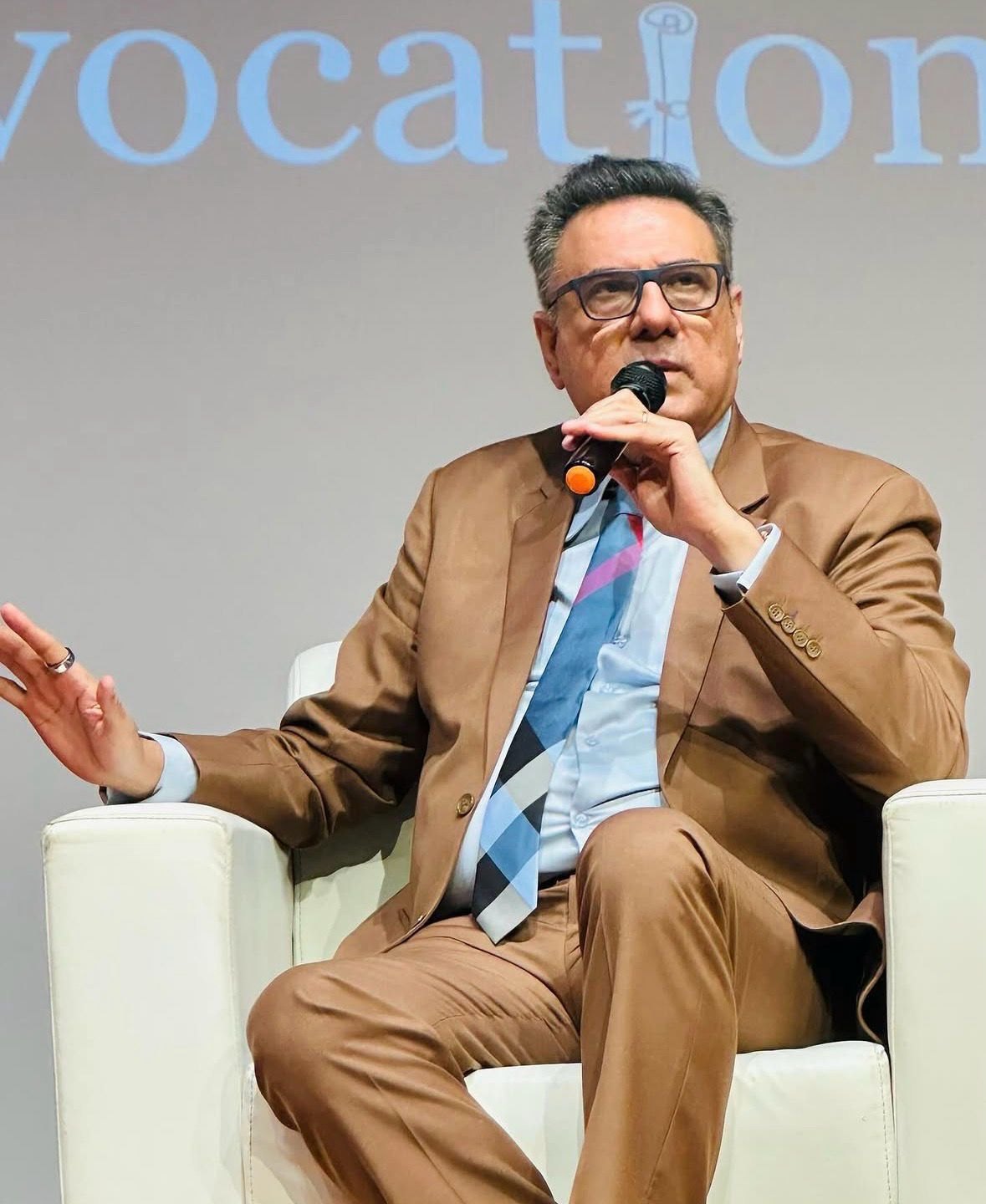 A speaker in conversation at a Youth Global festival