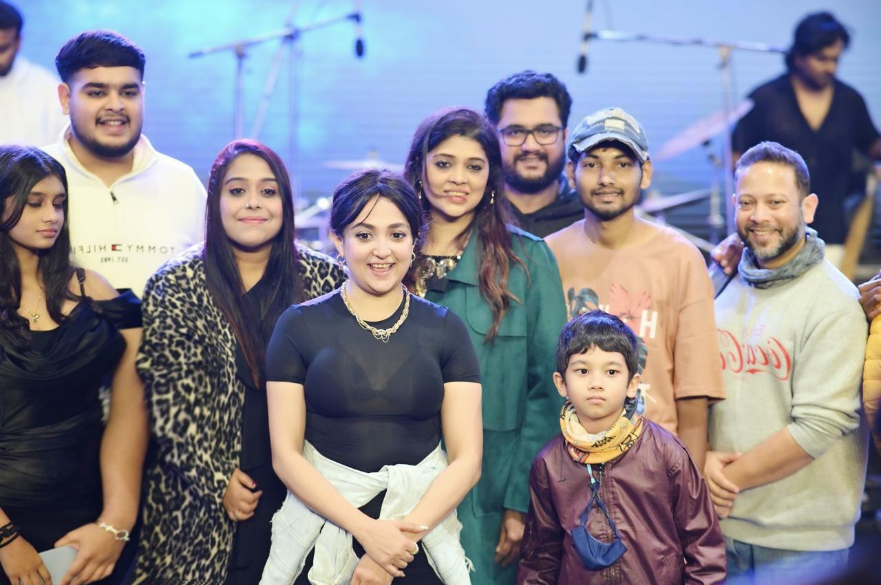 Artists and the team on stage after a show