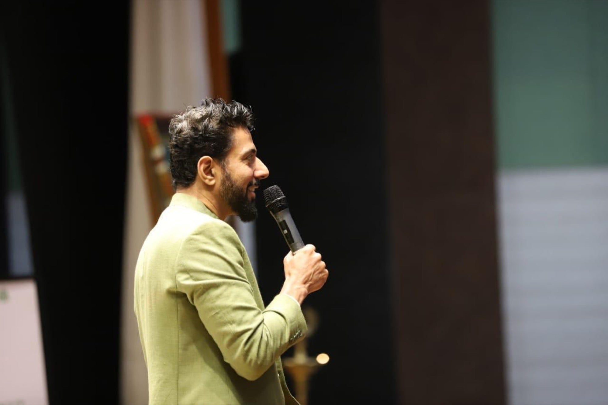 A speaker addressing students at YOUth Talks
