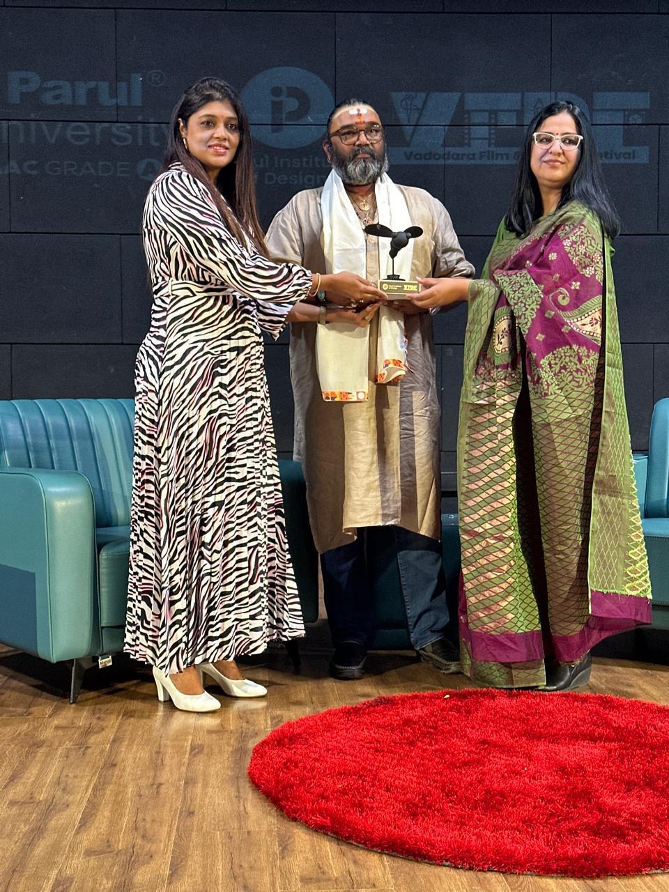 An award presented on stage at the Vadodara Film & Design Festival