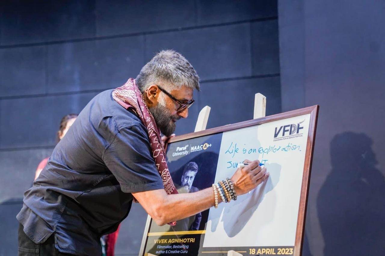 Signing the board at the Vadodara Film & Design Festival